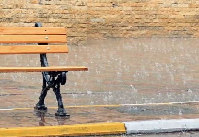 park bench in the rain